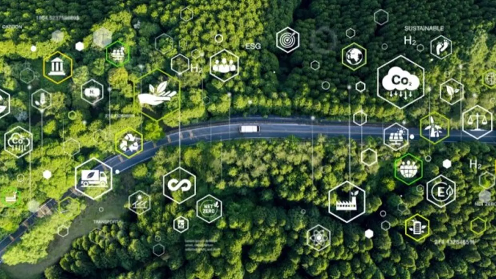 Road seen from above, winding through green forest. Lines and shapes branch off from the road, with symbols such as a factory and a windmill.