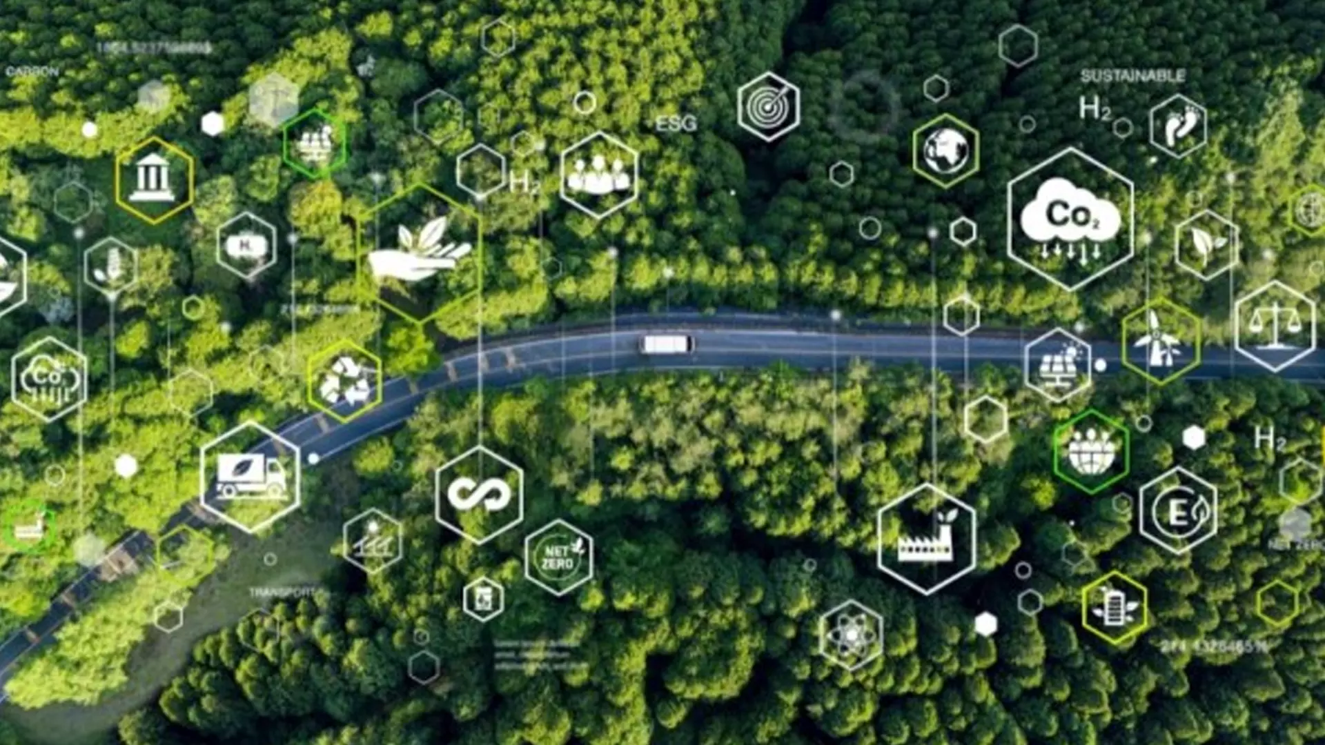 Road seen from above, winding through green forest. Lines and shapes branch off from the road, with symbols such as a factory and a windmill.