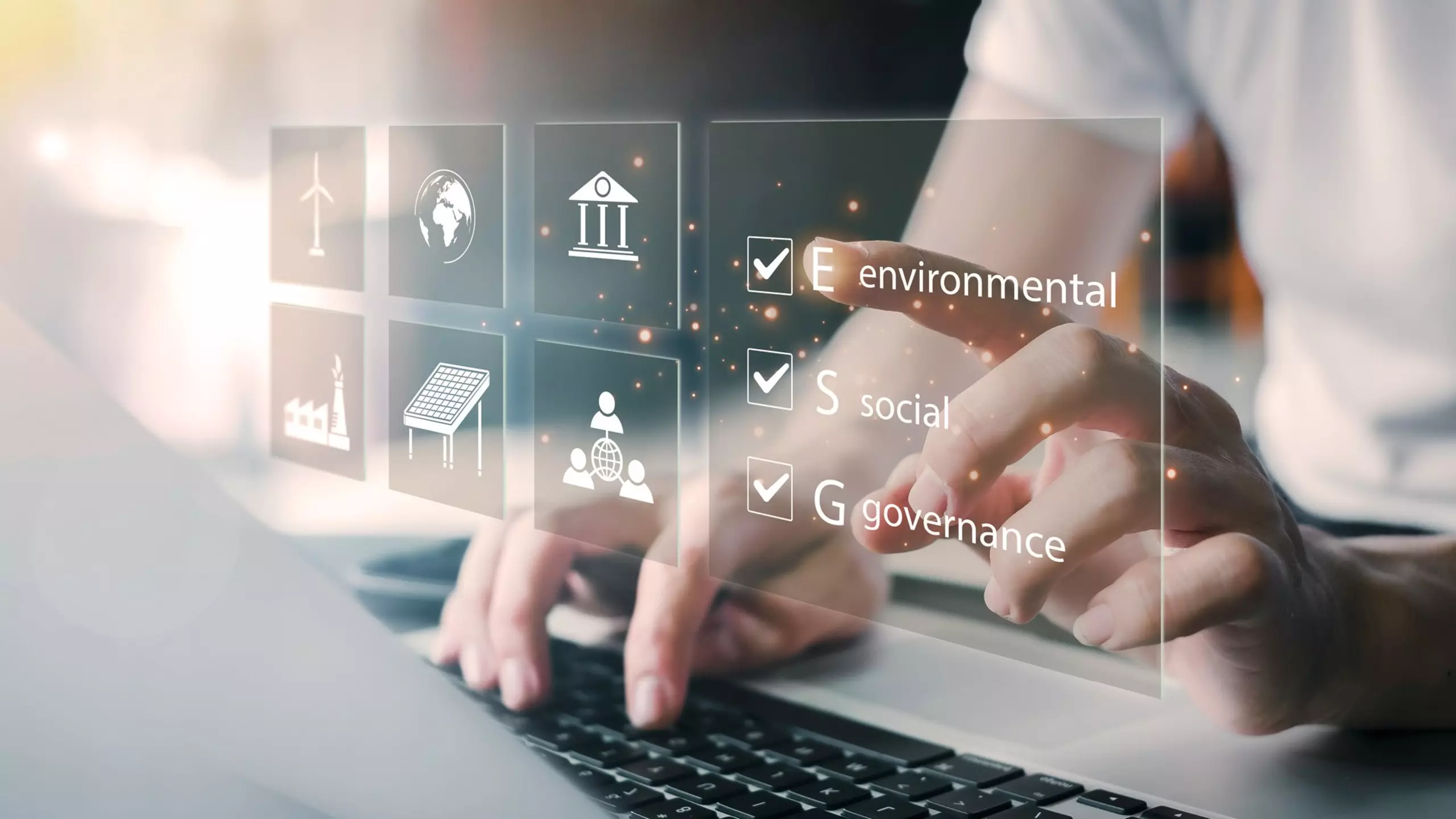 Hand selecting ESG criteria on a digital interface.