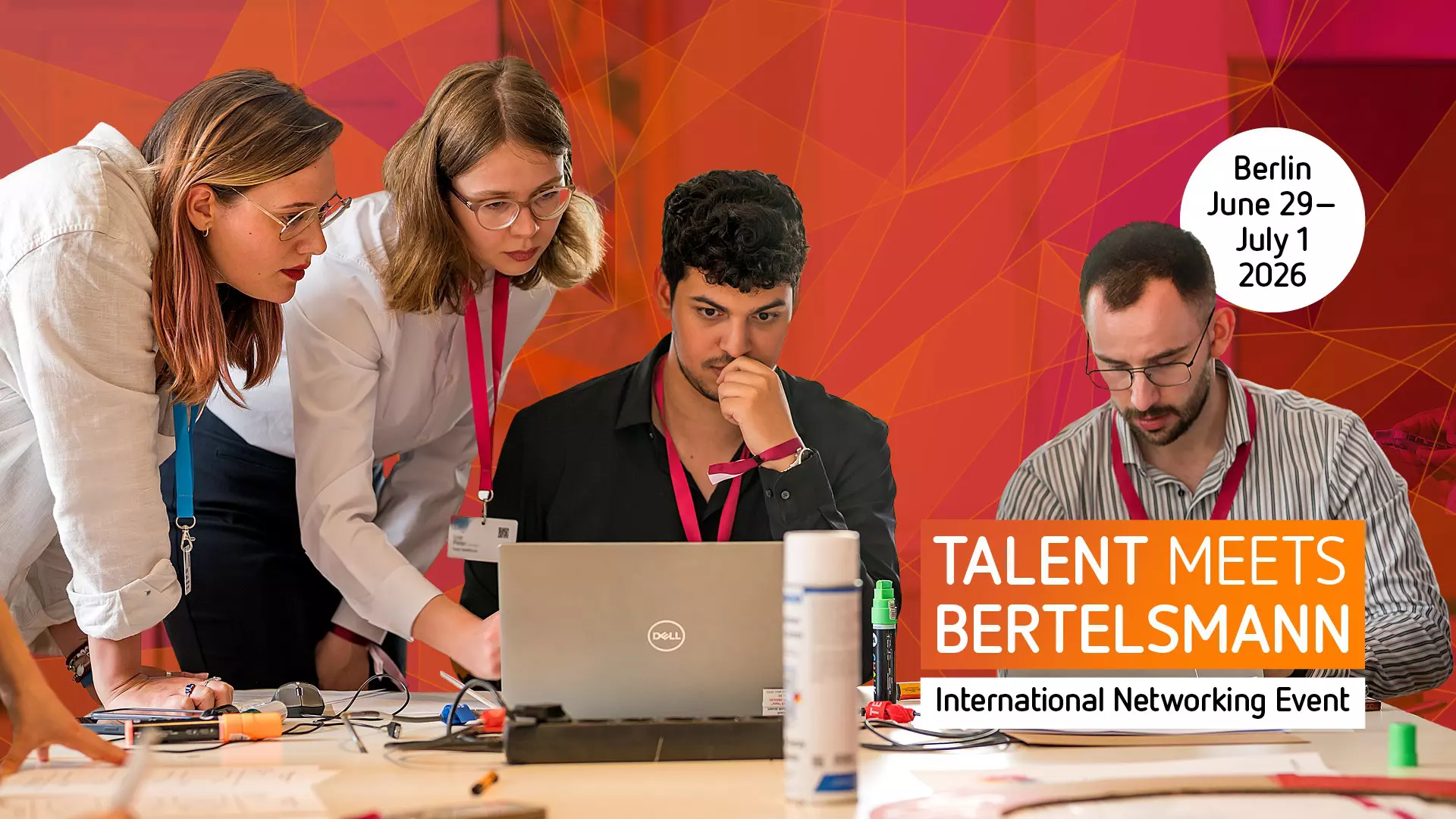 Several people looking at a  Laptop,image features the text "Talent Meets Bertelsmann"