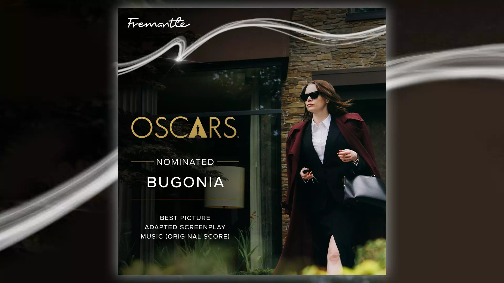 The series Bugonia with Emma Stone in a burgundy coat and sunglasses, walking towards the audience.
