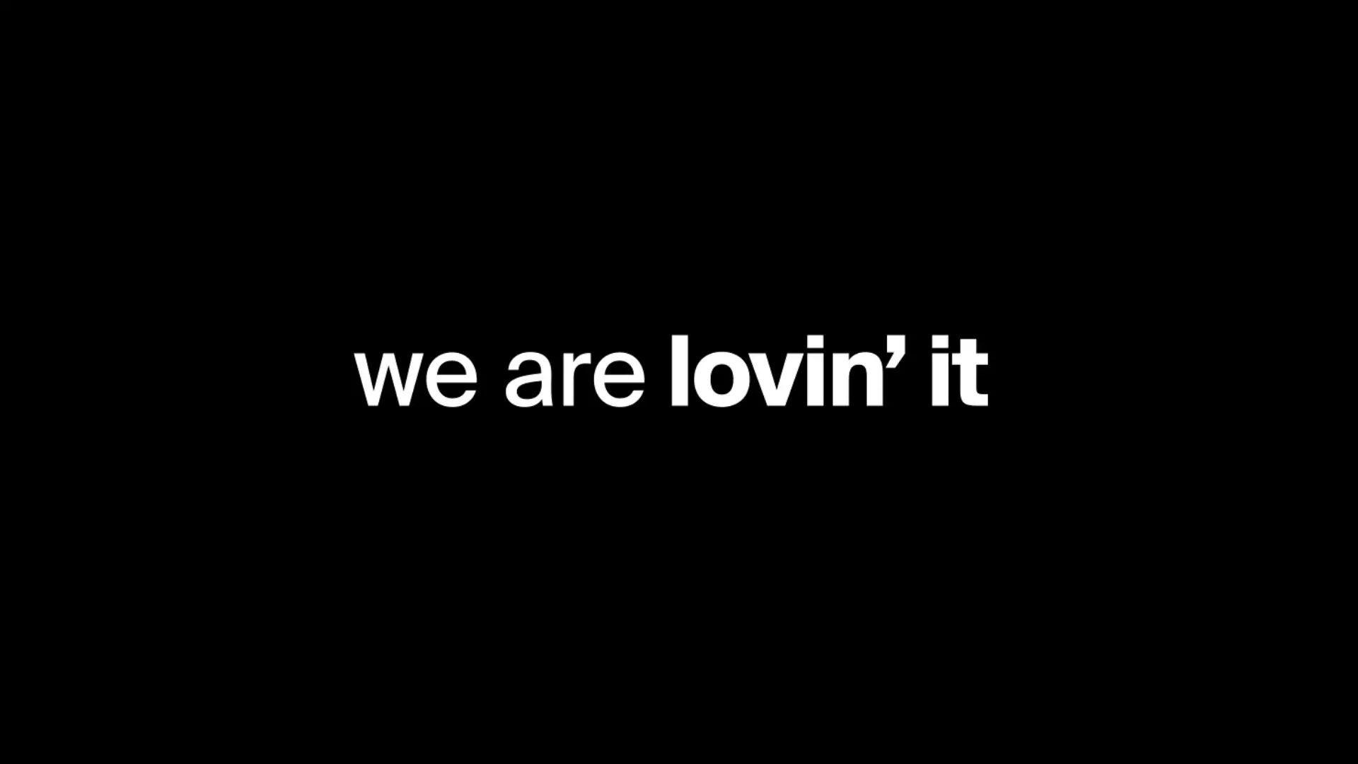 White lettering on a black background: We are lovin' it