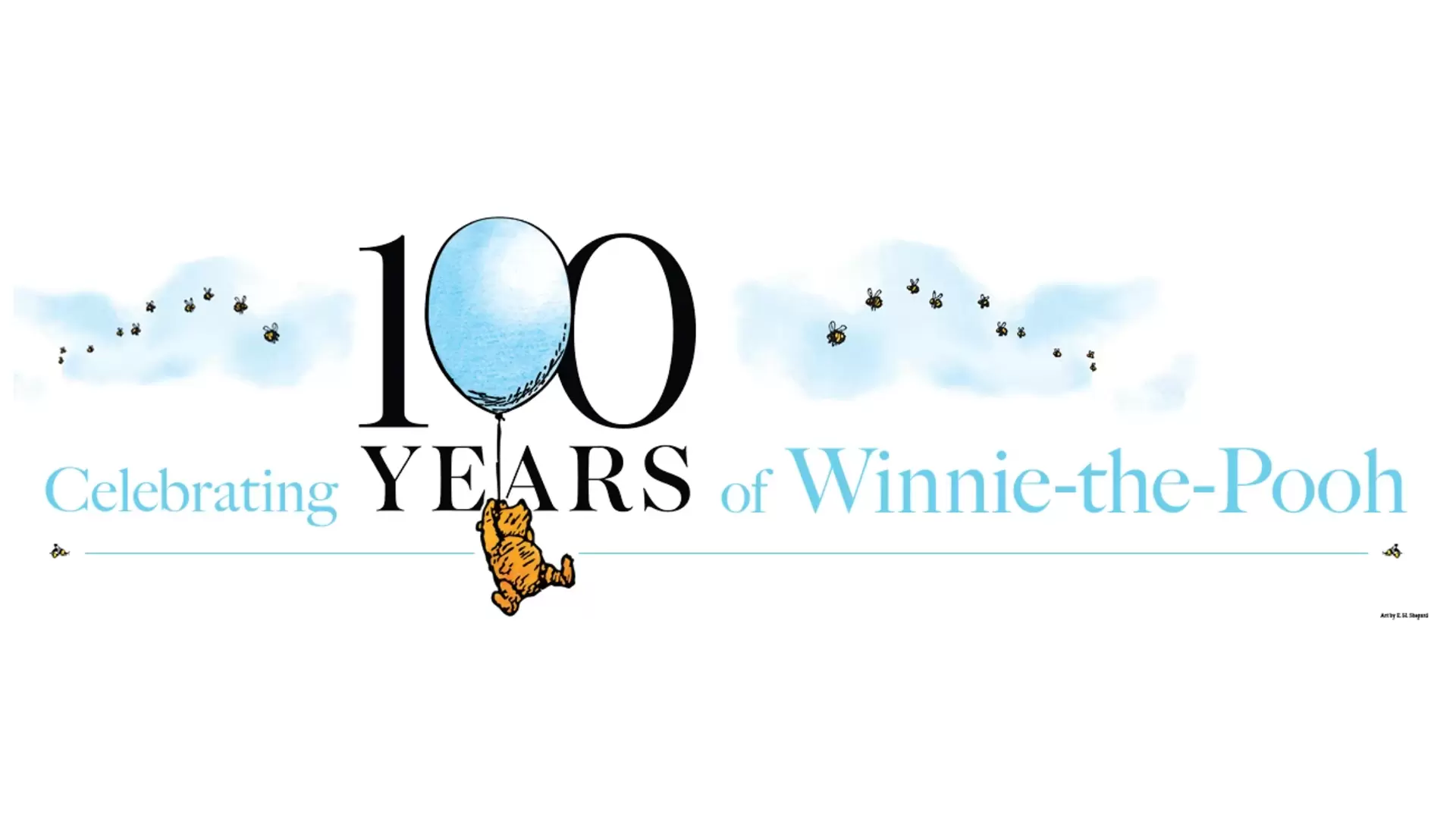 Writing "Celebrating 100 Years of Winnie-the-Pooh" in front of a white background