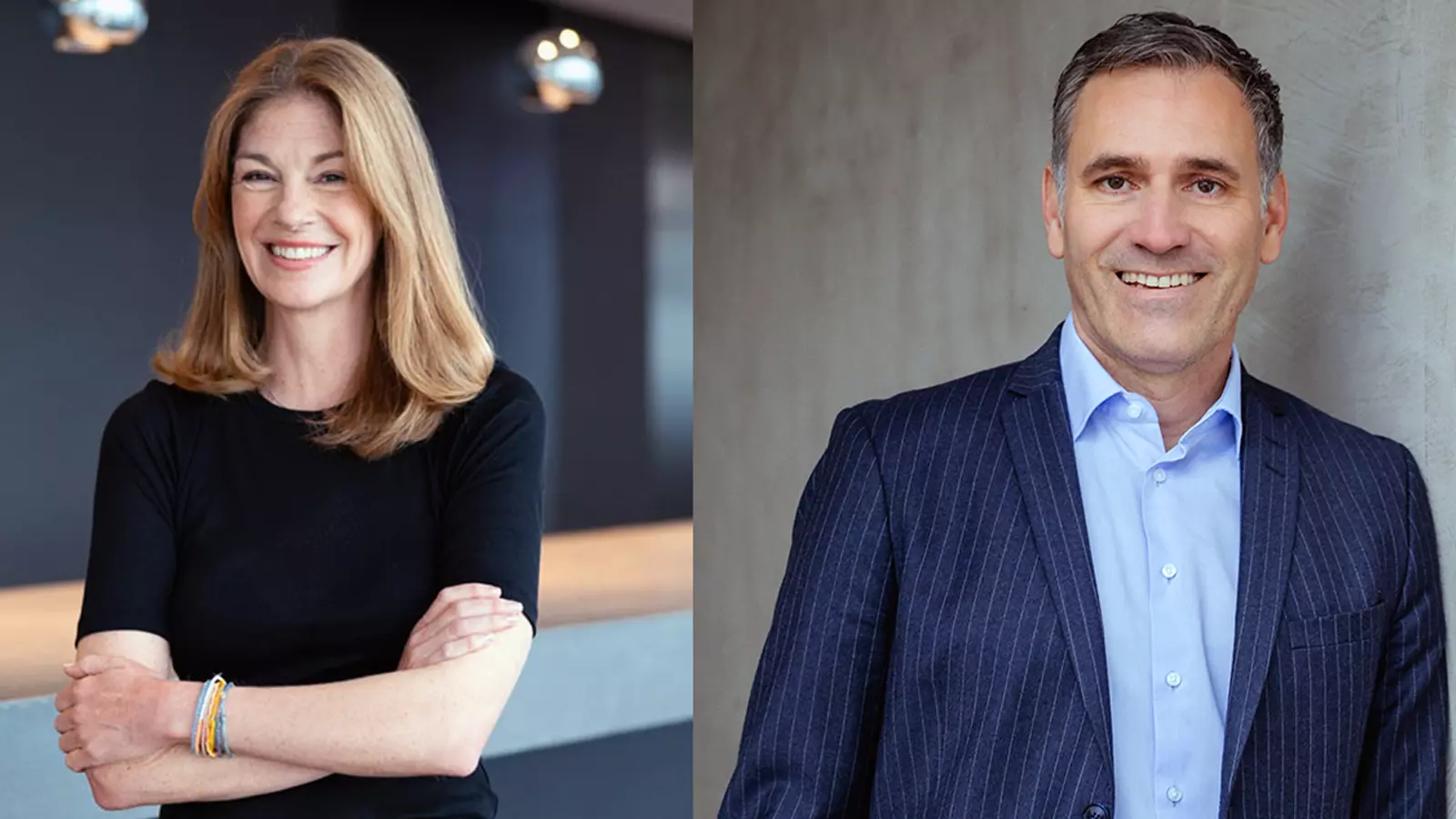 Two people in professional attire stand indoors, one with folded arms and one positioned beside a wall.