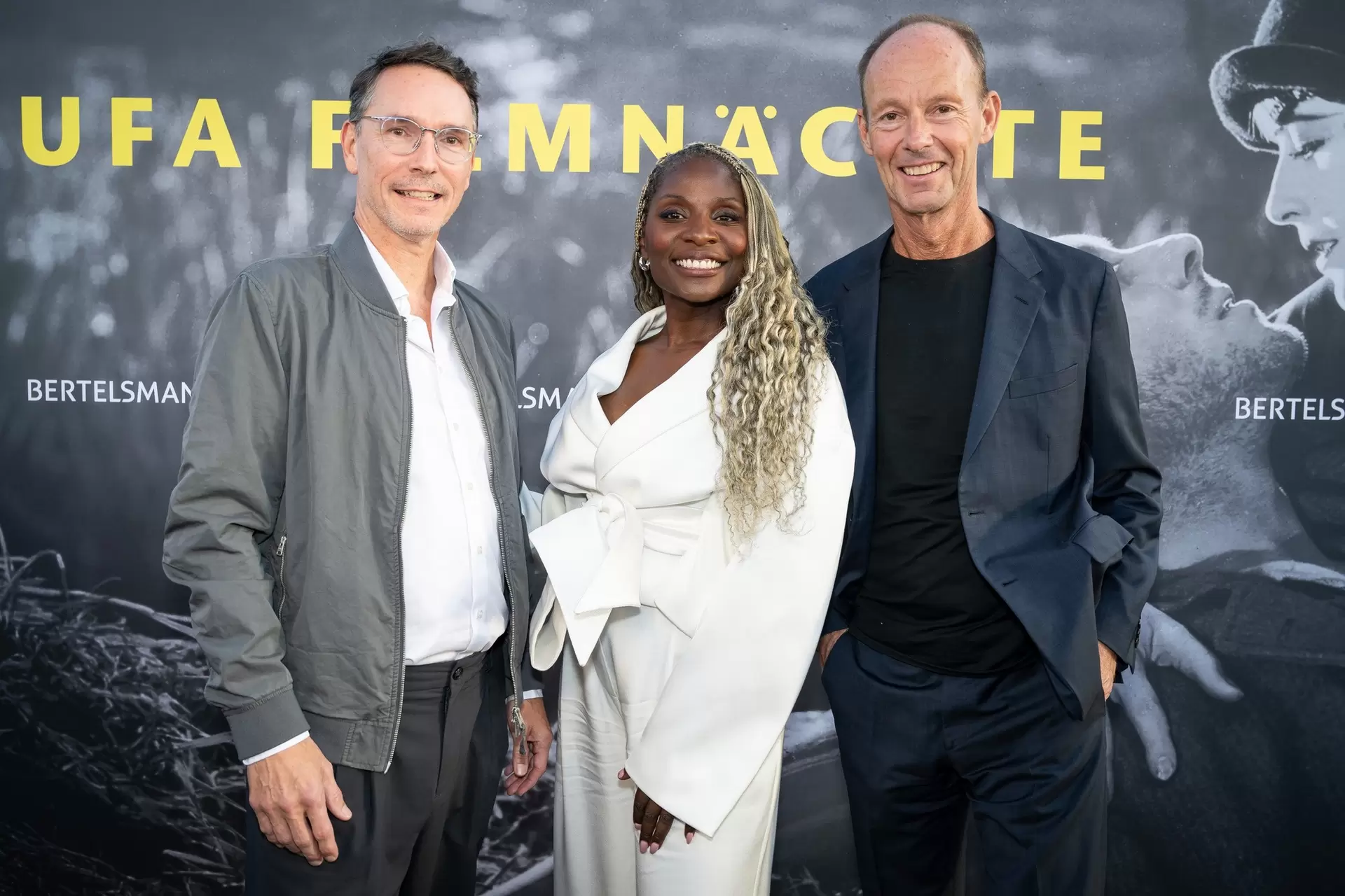 UFA CEO Sascha Schwingel, film ambassador Nikeata Thompson, and Bertelsmann CEO Thomas Rabe at the reception for the 2026 UFA Film Nights